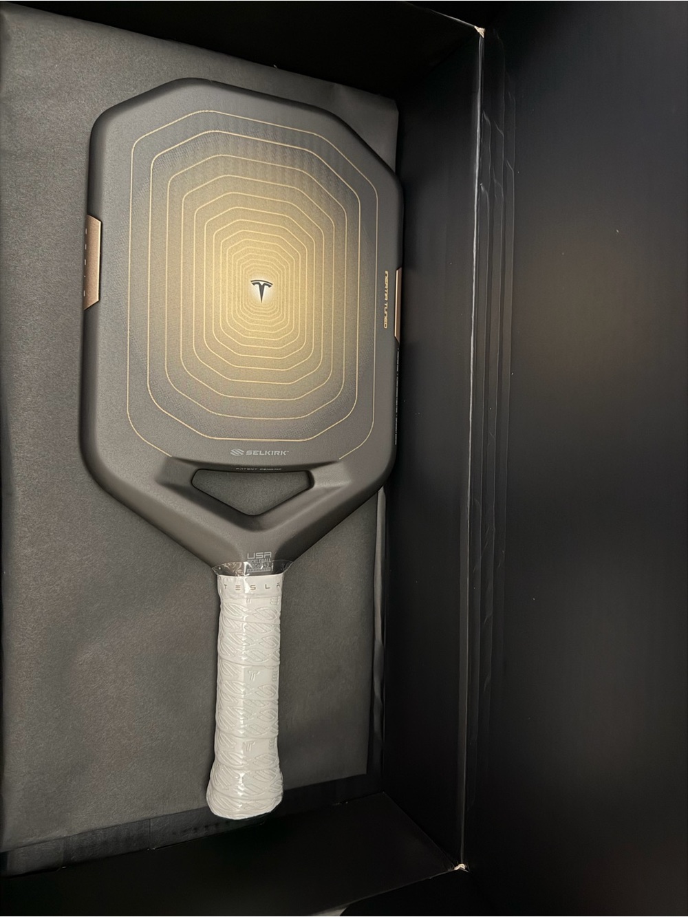 Tesla Black Pickleball Paddle with Gold Accents and White Grip